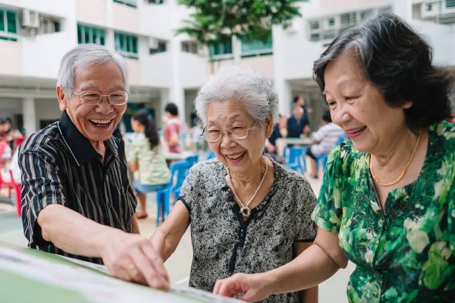 Residents working together at a table at a community activity